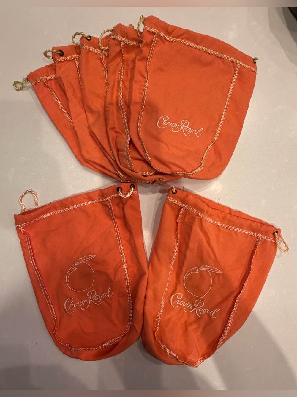 7 Crown Royal Orange Drawstring Bags - 2 w Peach Logo, 5 Crown Royal Logo only